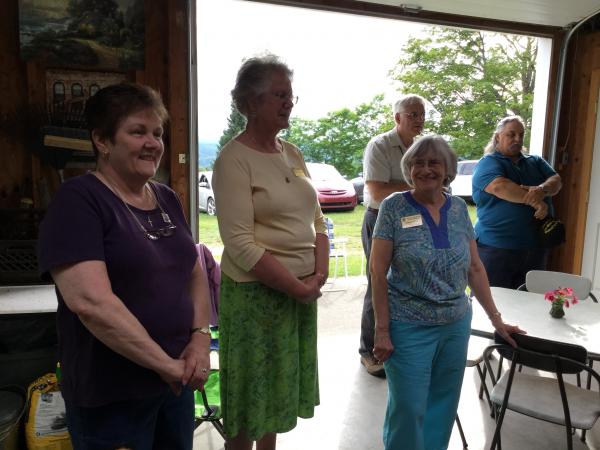 Rose Pelchuck, Loretta Schneider, Doris Voyer take a few minutes to visit at Bev's social in July.
